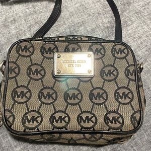 Black and gray Michael Kors crossbody